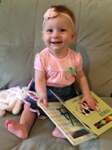Madelyn "reading" at seven months. She's in a book destruction phase, where she eats and tears the pages out of books, so we've learned that board books like the one in this picture are best at this age!
